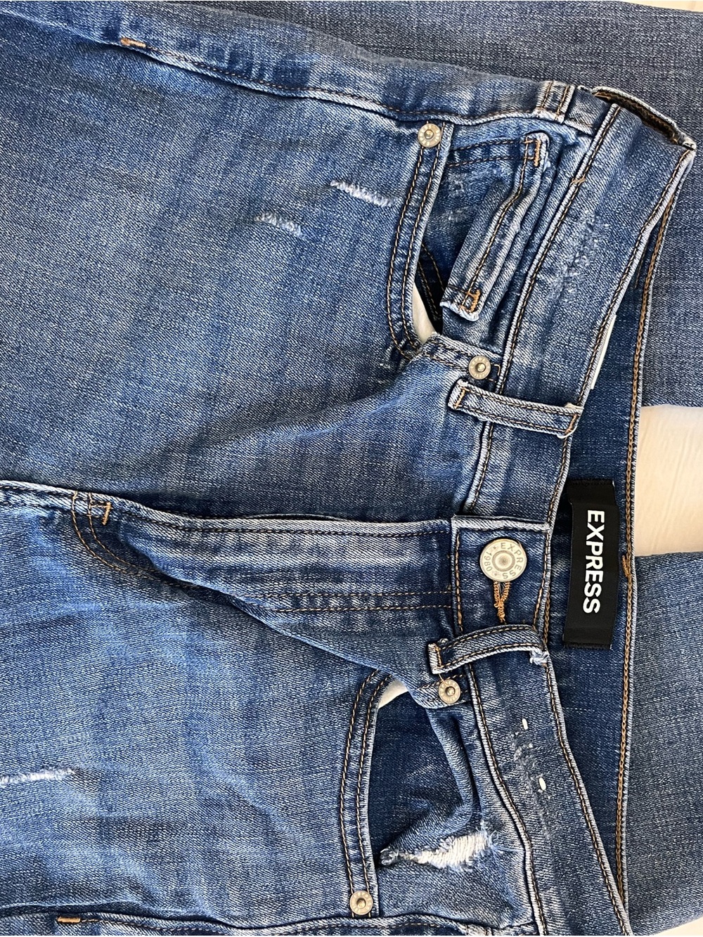 Express Women's Medium Blue Straight Leg Jeans with Subtle Distressing